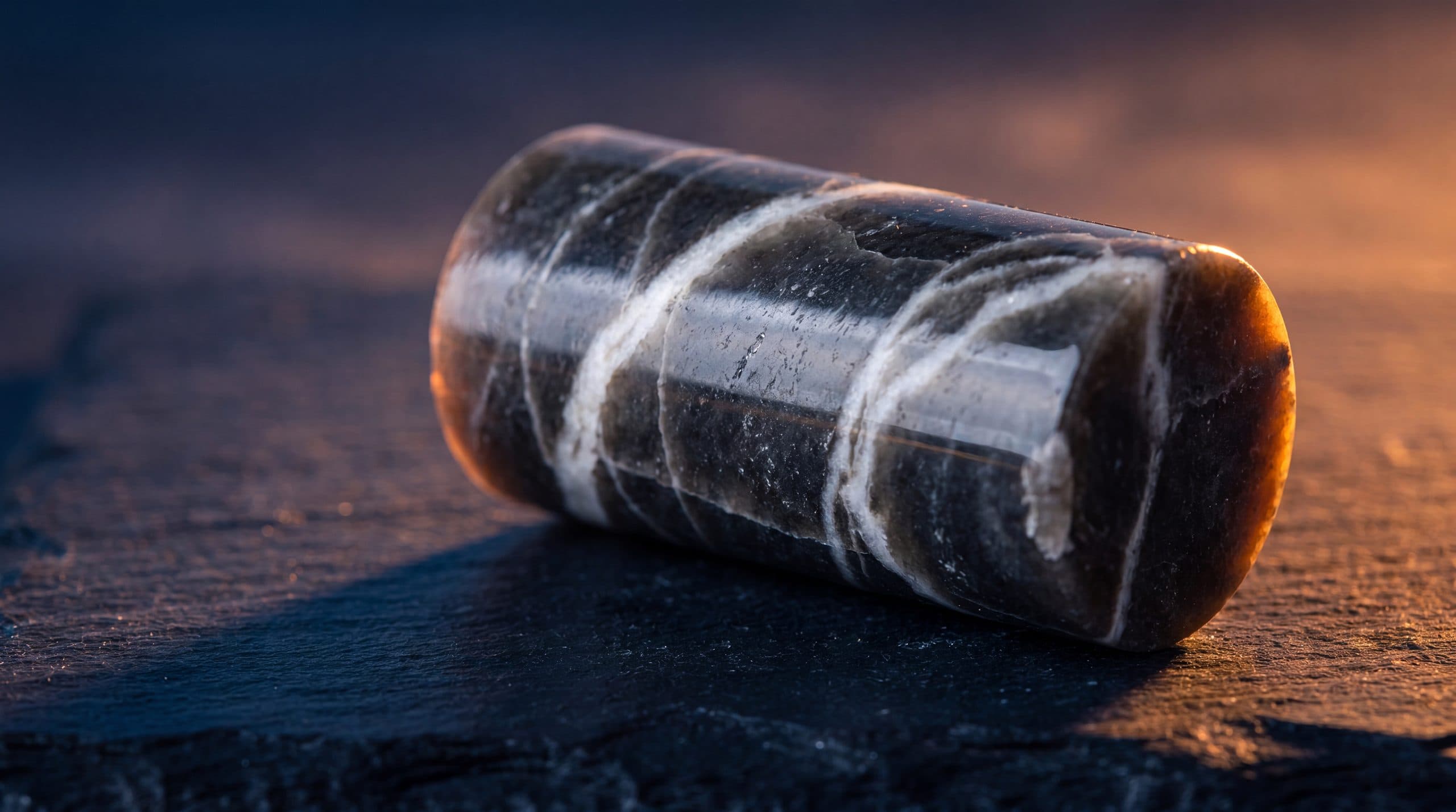 A core sample of mineral carbonate held in a laboratory.